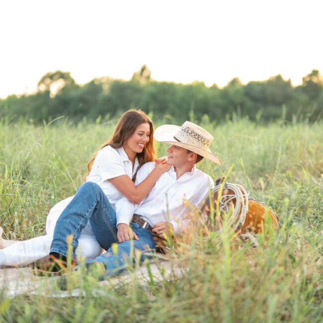 Couple having a picnic in a summer field